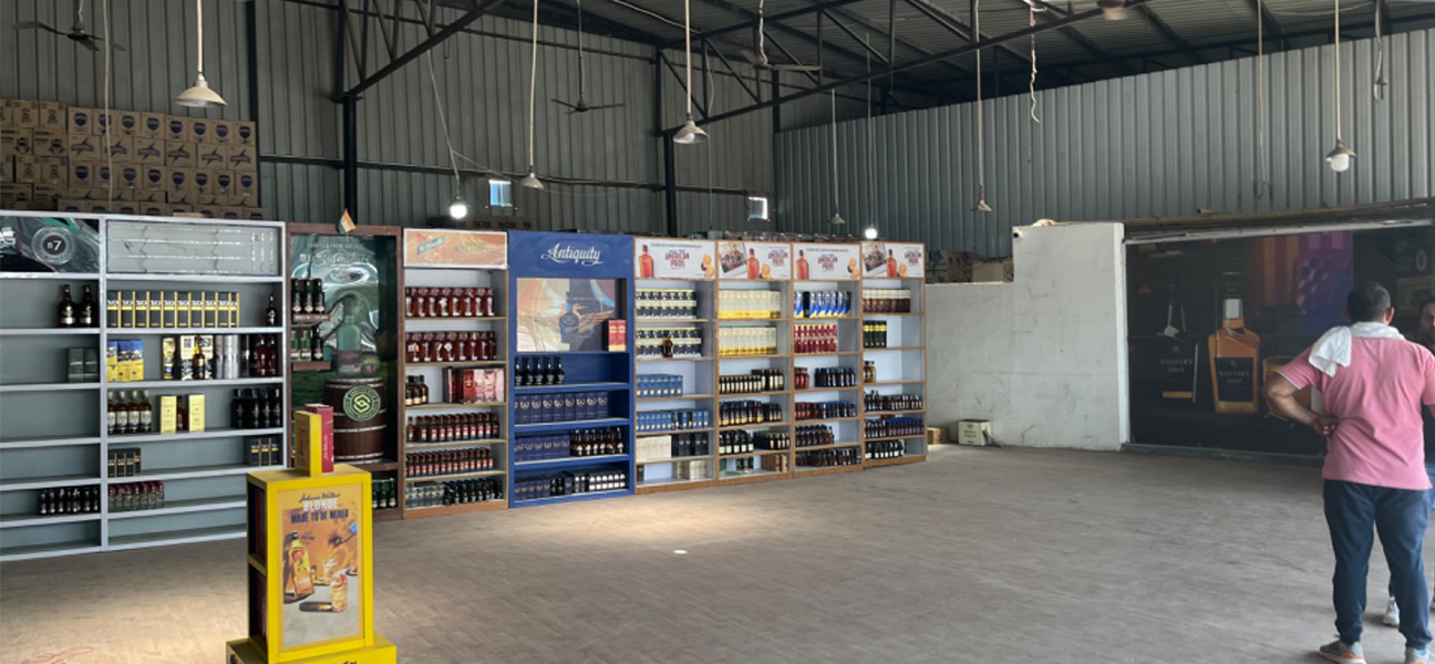 Woodnote Brand Shop Bahadurgarh retail liquor store interior by Next BC
